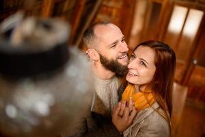 Close up portrait of happy smiling couple in love, guy kissing his girlfriend. photo