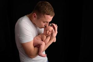 Father holds his newborn daughter photo