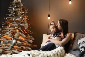 Mother and daughter have fun together before christmas. photo