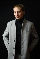 Portrait of handsome stylish man in elegant autumn coat photo