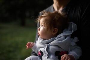 Young father having fun with his little daughter in park photo