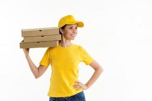 Woman in yellow pizza delivery girl on white background photo