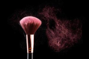 Concept of makeup brush and dusting.