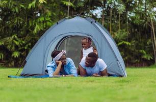 Cheerful african american family enjoying in the park, Happiness family concepts photo