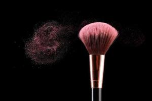 Makeup brush and dust. photo