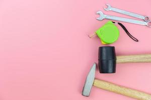 Top view with copy space of Craft tools group overhead on pink pastel background, Craft working flat lay concept photo
