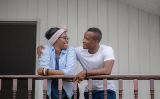 Cheerful african american couple at wooden balcony, happiness family concepts photo