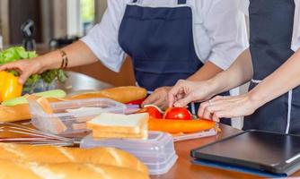 Senior asian mother and middle aged daughter cooking together at kitchen, Happiness asian family concepts photo