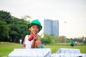 Portrait of happy african american kids boy playing outdoors in a park, Kid playing concept. photo