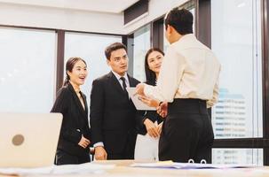 Success and Teamwork concept, Group of young business people meeting in office photo