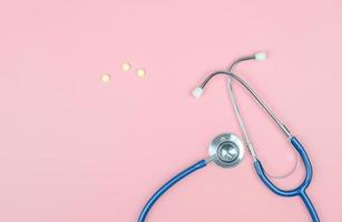 Top view with copy space of Stethoscope on the pink background, Medical and Healthy concept photo