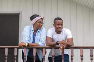 Cheerful african american couple at wooden balcony, happiness family concepts photo