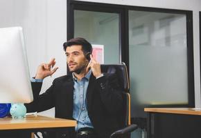 Happiness and smiling young beautiful business man with headphones, Professional operator service concept photo