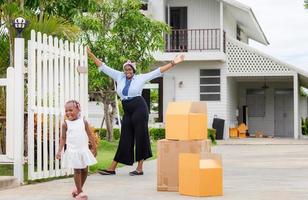 Cheerful African american mother and daughter at a new home photo