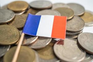 Stack of coins money with France flag, finance banking concept. photo