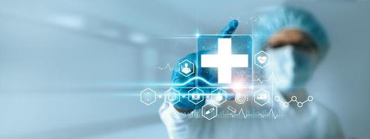 Medicine doctor holding medical cross icon with icon healthcare network connection on modern virtual interface on hospital background, Innovation and healthcare technology concept. photo