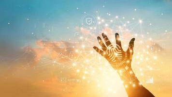 Hand with fingerprint identification to access personal business data. Idea for E-kyc electronic know your customer. Biometrics security, Technology intelligent safety and cyber secure data exchange photo