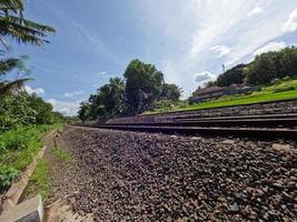 The view of the rail road in Yogyakarta Indonesia, visible rocks and a clear sky background photo