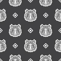 Polynesian style tiger face seamless pattern. Boho tiger face. Good for clothing and textiles. Vector