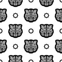 Black and white Seamless pattern with tiger face in boho style. Polynesian style tiger face. Good for backgrounds, prints, apparel and textiles. Vector illustration.