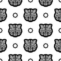 Black and white Seamless pattern with tiger face in boho style. Polynesian style tiger face. Good for backgrounds, prints, apparel and textiles. Vector illustration.