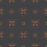 Seamless pattern with tiger face in colored boho style. Polynesian style tiger face. Good for backgrounds and prints. Vector