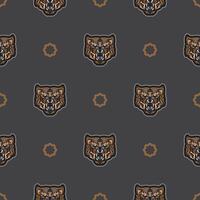 Seamless pattern with tiger face in colored boho style. Polynesian style tiger face. Good for backgrounds and prints. Vector