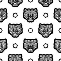 Black and white Seamless pattern with tiger face in boho style. Polynesian style tiger face. Good for backgrounds, prints, apparel and textiles. Vector