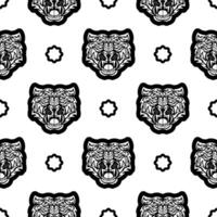 Black and white Seamless pattern with tiger face in boho style. Polynesian style tiger face. Good for backgrounds, prints, apparel and textiles. Vector