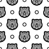 Black and white Seamless pattern with tiger face in boho style. Polynesian style tiger face. Good for backgrounds and prints. Vector