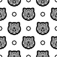 Black and white Seamless pattern with tiger face in boho style. Polynesian style tiger face. Good for backgrounds and prints. Vector