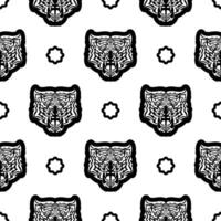Black and white Seamless pattern with tiger face in boho style. Polynesian style tiger face. Good for backgrounds and prints. Vector illustration.