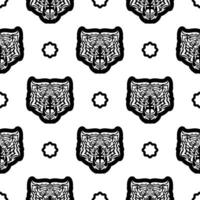 Black and white Seamless pattern with tiger face in boho style. Polynesian style tiger face. Good for backgrounds and prints. Vector illustration.