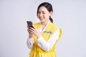 Portrait of Asian female construction engineer on white background photo