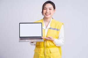 Portrait of Asian female construction engineer on white background photo