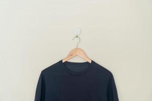 t-shirt hanging with wood hanger photo