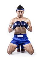 Thai boxer with thai boxing action, isolated on white background photo