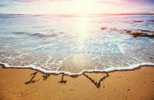 drawings in the sand on the beach photo