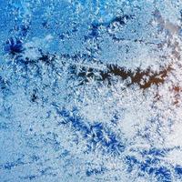 texture of patterns on frozen window glass photo
