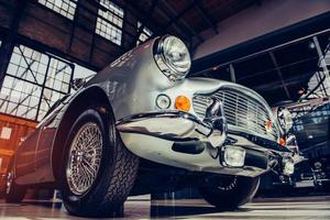 closeup of the headlights and front bumper on  vintage automo photo