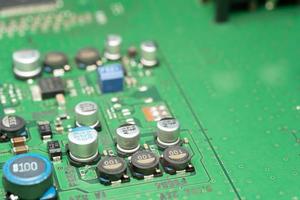 chip on green pcb board. Electronic circuit board close up. photo