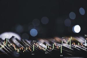 Coins stacking with technical stock market graph for Trader investor analysis concept. photo