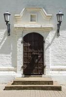 Old wooden door stone wall photo