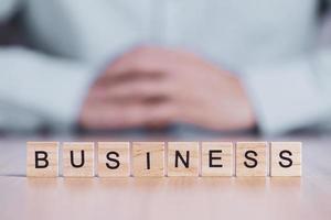 Business word close up on wooden block cubes. business creative motivation concept photo