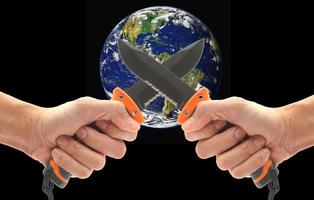 Concept, Hand holding a knife to stab the world. Violence in the world. Elements of this image furnished by NASA photo