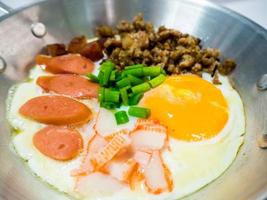 Pan-fried egg with toppings in my homemade Thai style photo