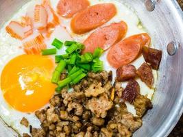 Pan-fried egg with toppings in my homemade Thai style photo