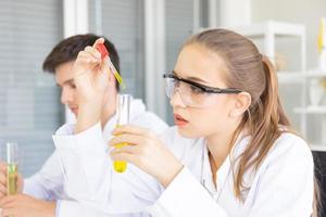 Laboratory research Team work, people, scientists analyze data, study and evaluate test tube success. Healthcare researchers doing research with chemical testing sciences photo
