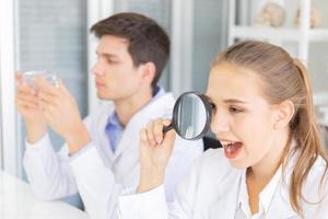Laboratory research Teamwork, people, scientists analyze data, study and assess the success of magnifiers. Healthcare researchers conducting research with science, chemical testing. photo