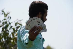 playing cards in hand with a man - Poker concept photo